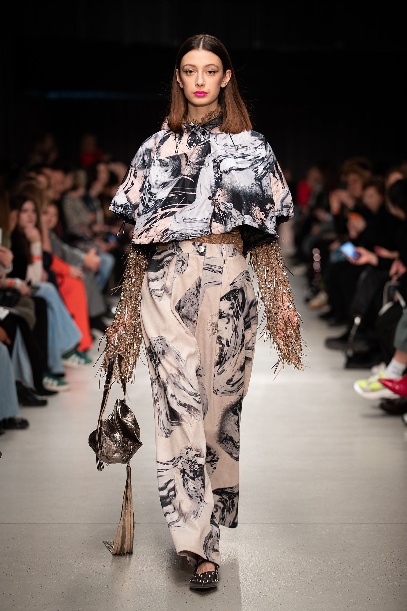 model wears hooded cropped puffy jacket during BCEFW