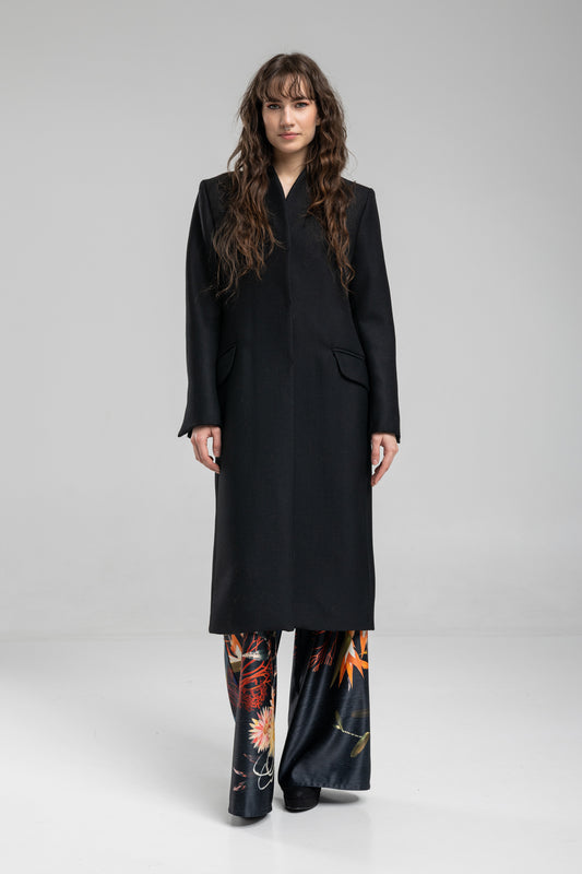 simple black coat with classic tailoring