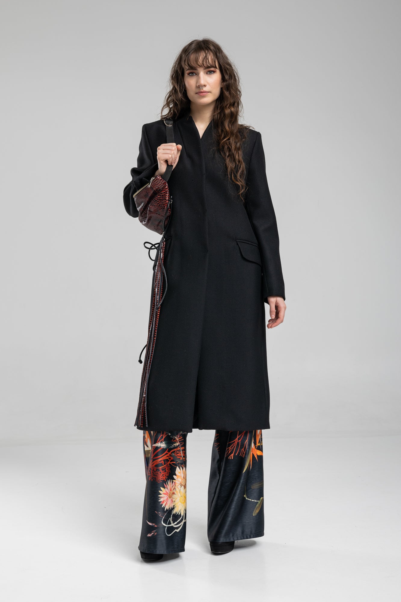 black coat with unique stand collar and button down closure