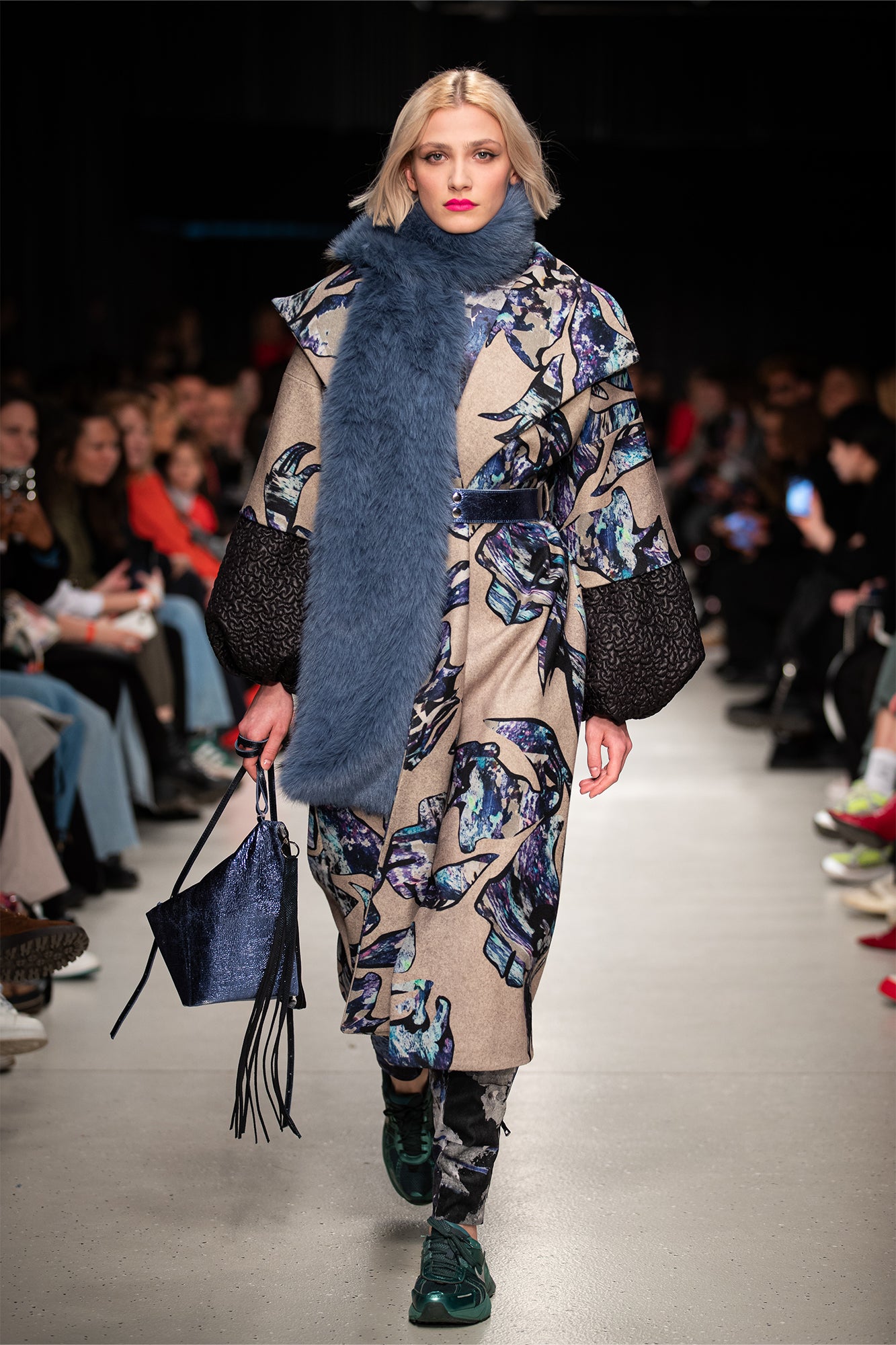model walking on the runway of BCEFW wearing overlapped unique digital printed maxi coat