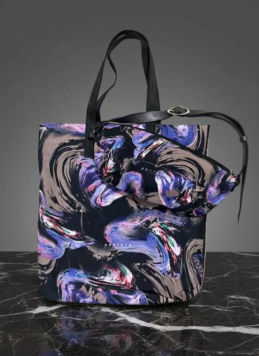Colorful tote bag with abstract design on a dark surface