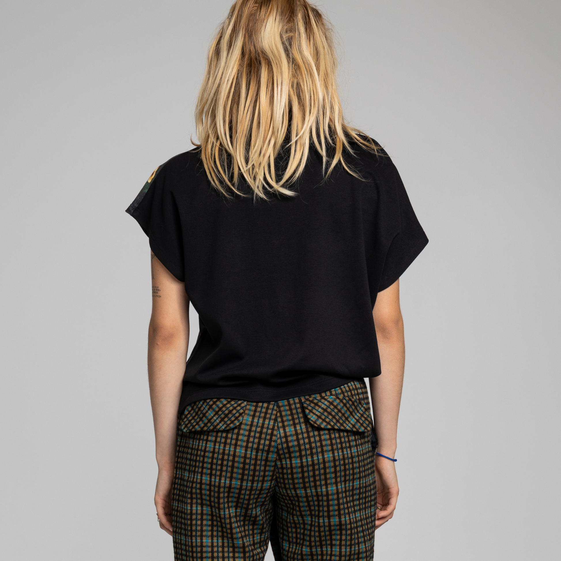 loose fitted top with plain black back and unique print on front