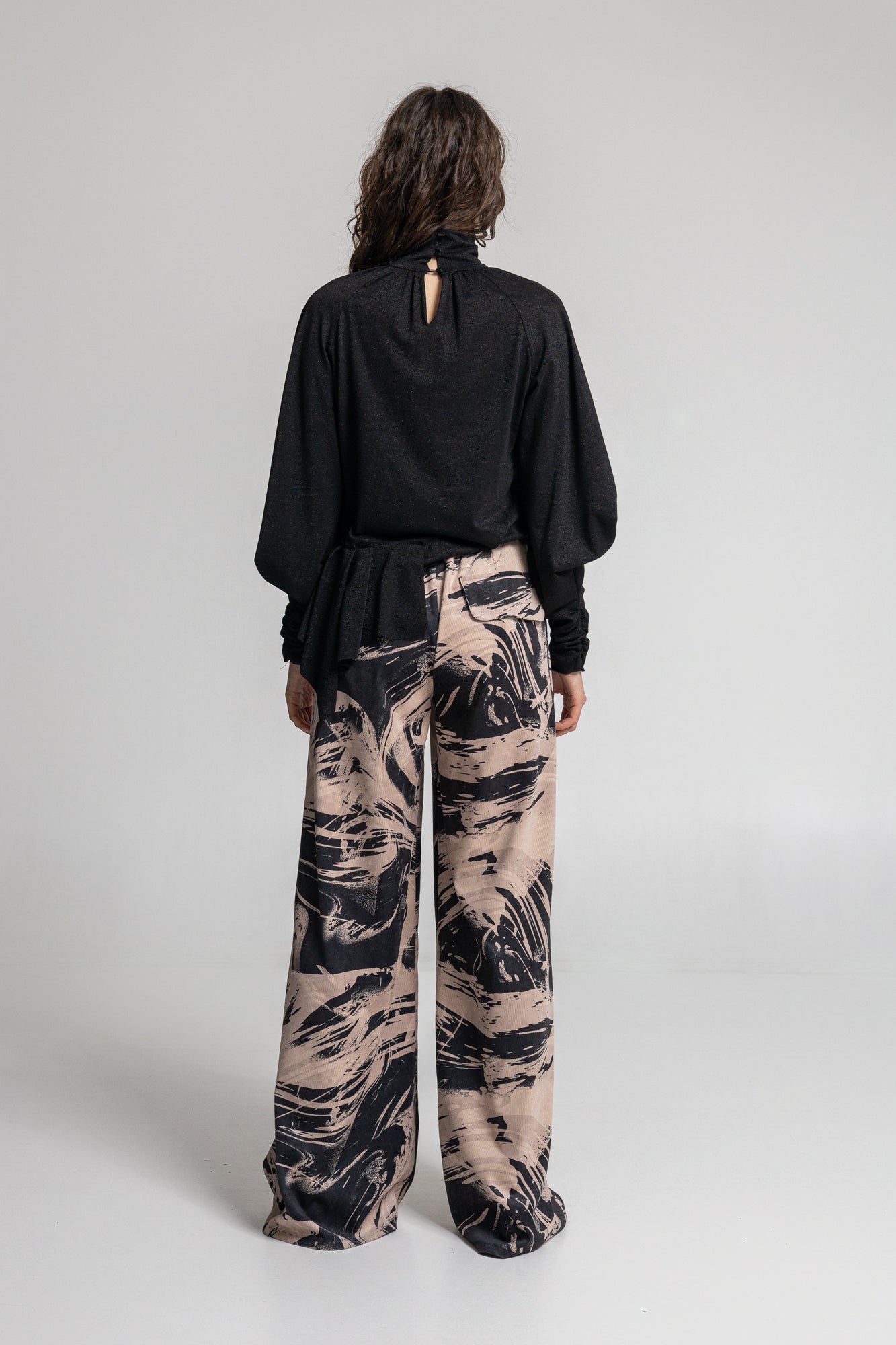 draped slightly elastic turtleneck with backslit button closing