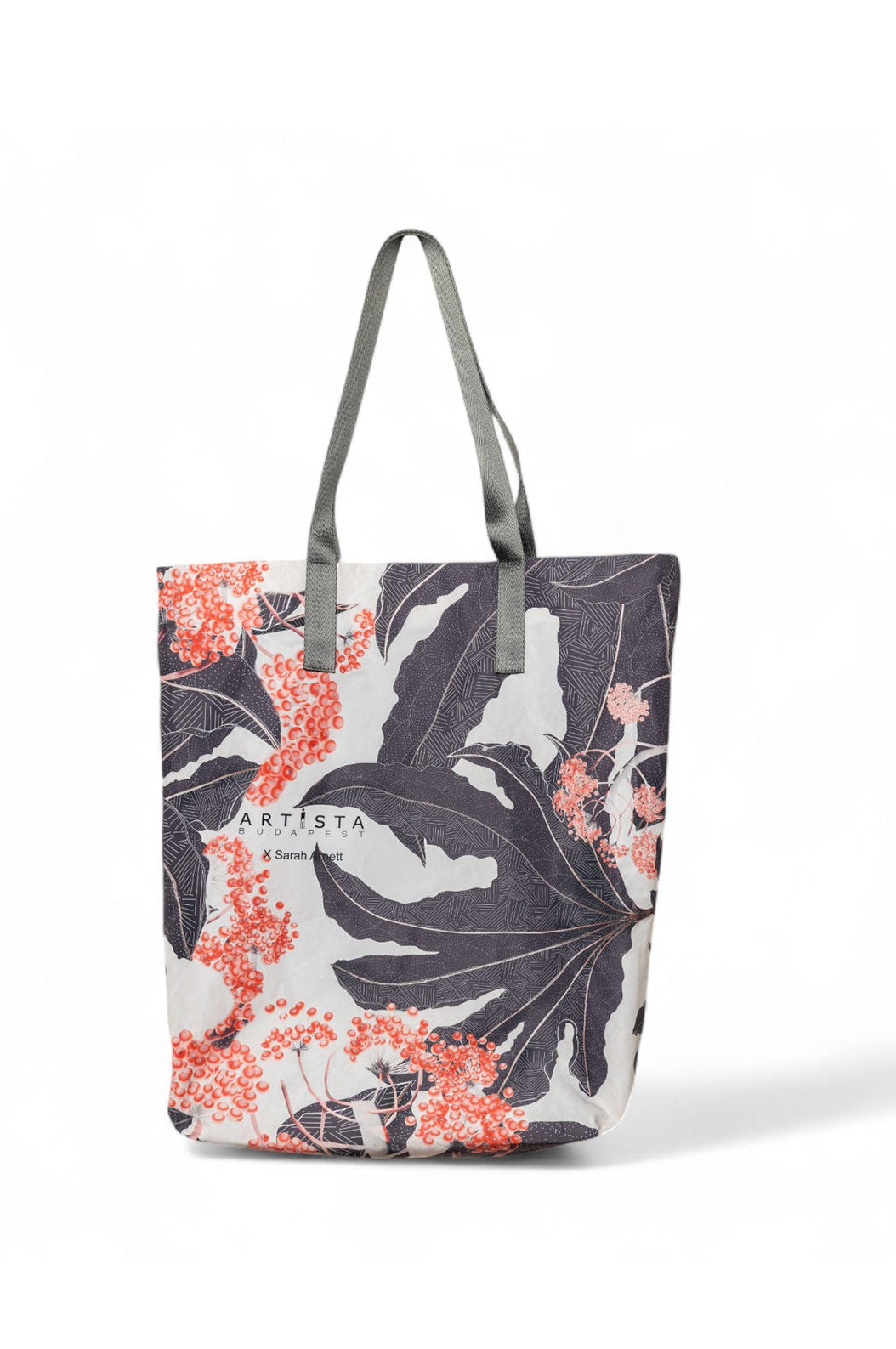 A multicolored tote bag with floral prints and solid-colored sections, displayed against a plain background.