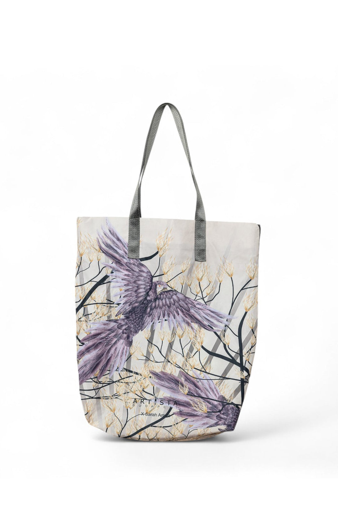 A multicolored tote bag with an animal print, featuring a bird, displayed against a plain background.