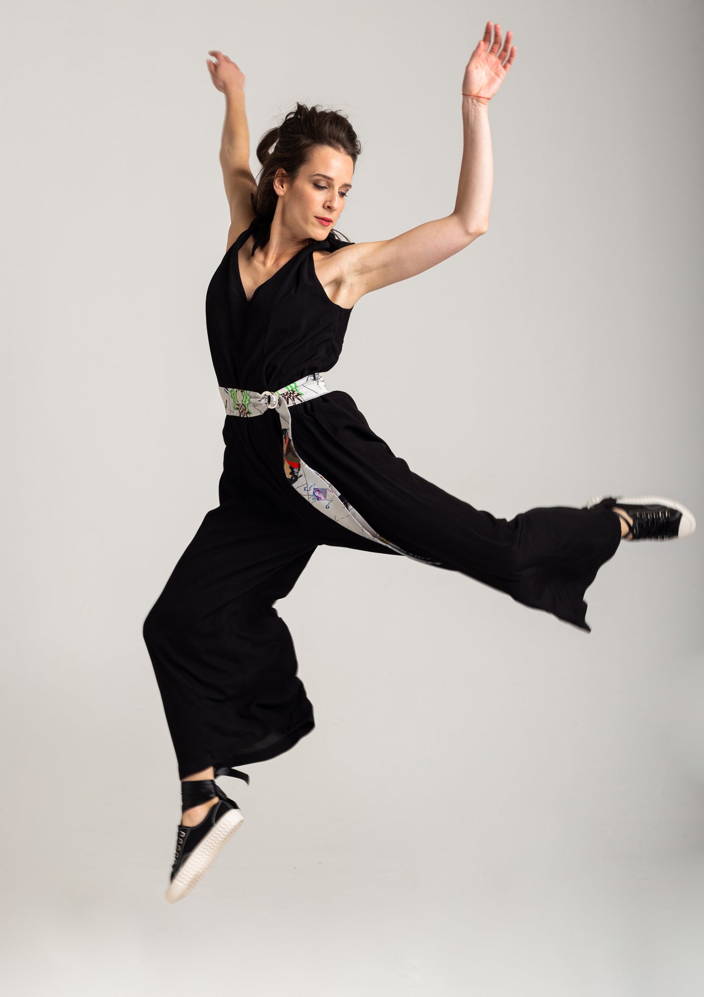 feminine black jumpsuit with zipup closure on front artista budapest