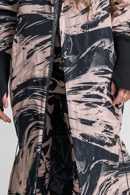 printed maxi coat with drawstring at knees to create a bubbly shape