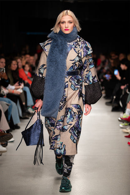 model walking on the runway of BCEFW wearing overlapped unique digital printed maxi coat