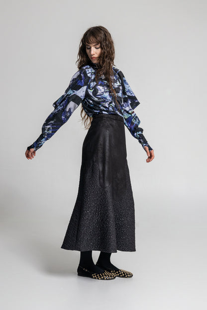 swirling crystal like printed drape top with geometric shaped long sleeves 