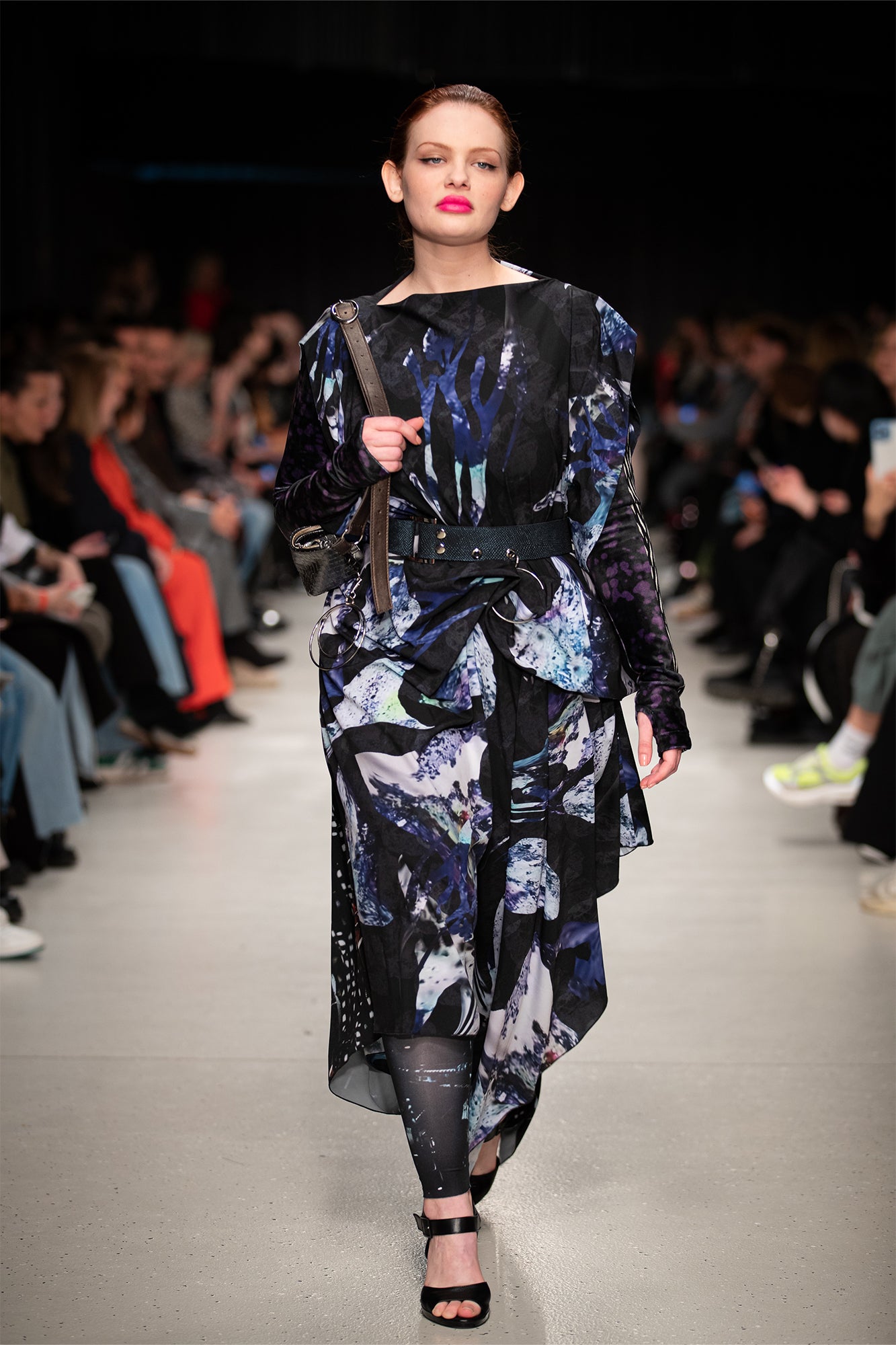 model showcases an asymmetric maxi cut dress at bcefw