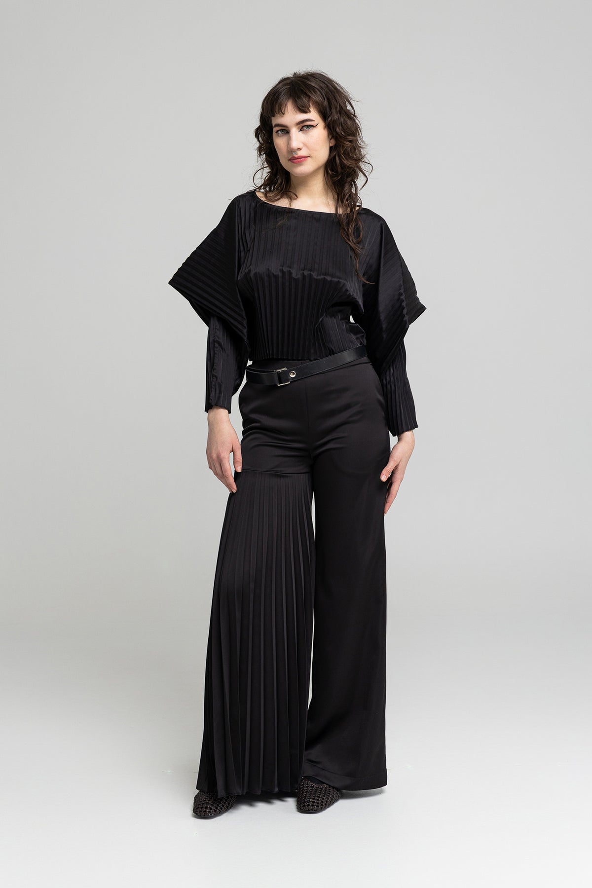 polished fabric asymmetric leg pants artista budapest