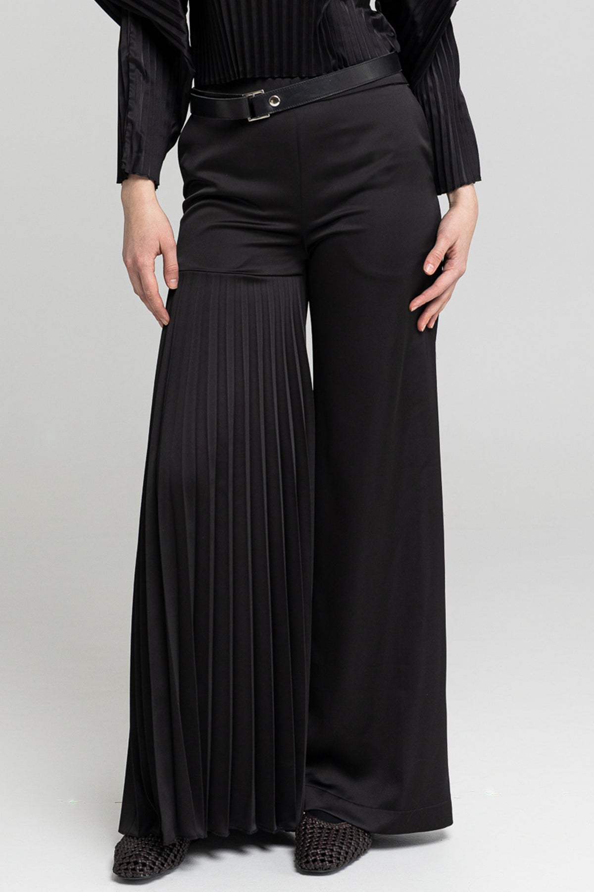 slightly elastic asymmetric leg pants artista budapest