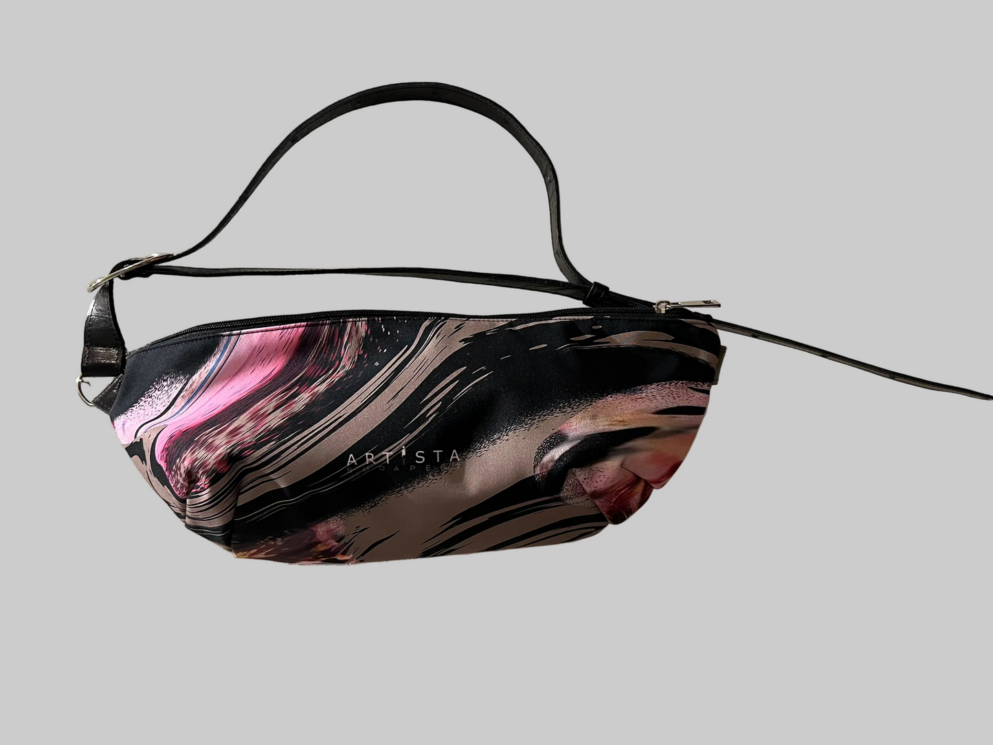 Marbled patterned bag with 'ARISTA' branding on a light background