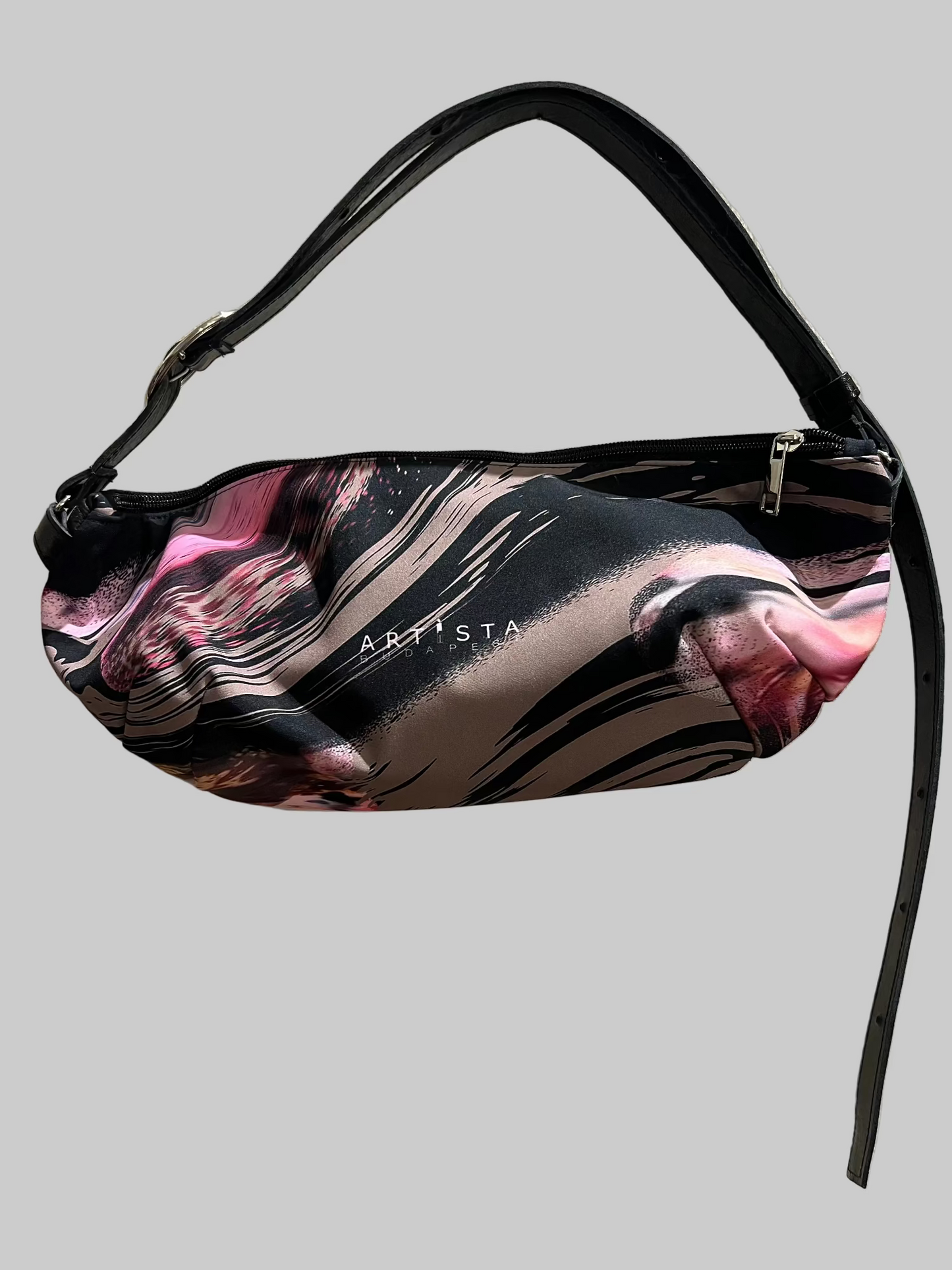 Floral patterned bag with 'Artista' branding on a plain background