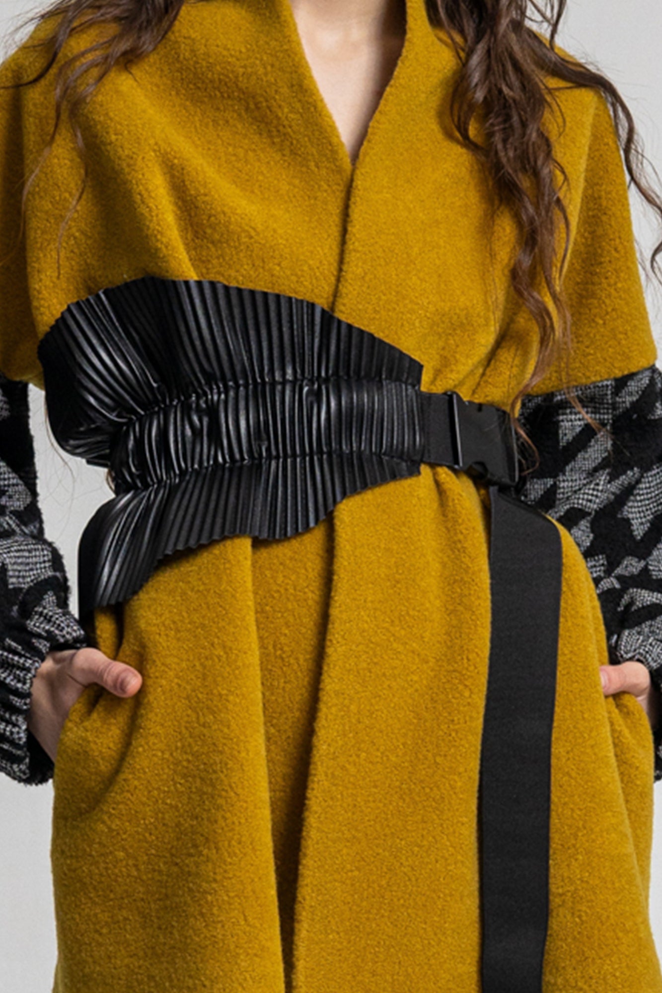 overlapped coat secured with leatherette asymmetric belt