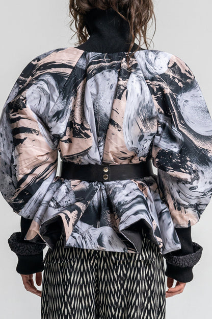 swirling black and pale pink printed puffy jacket