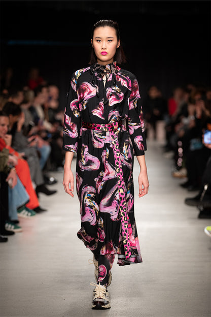 model walking on bcefw runway wearing the rose crystal embellished printed midi dress