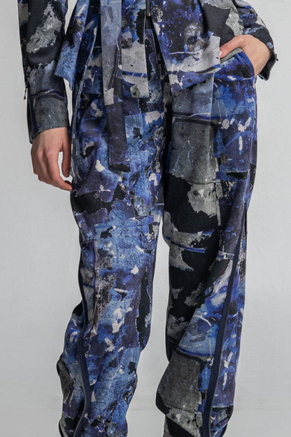 slightly elastic corduroy pants with unique hidden faces on print design